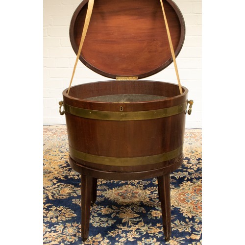 1395 - Geo. III brass banded coopered mahogany oval wine cooler, with hinged top and two brass carry handle... 