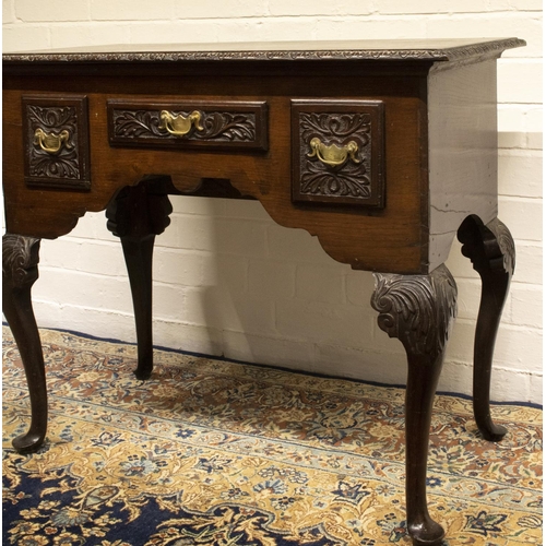 2200 - The Grange Goathland - Geo.111 oak lowboy, moulded top and three frieze drawers with brass handles, ... 