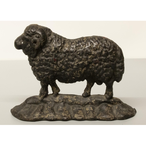 2053 - The Grange Goathland - Early C20th black painted cast iron door porter in form of a ram, on naturali... 