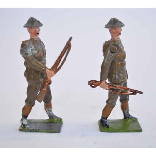 2113 - The Grange Goathland - Two vintage W.Britain's hollow lead cast British Army soldier sets, both righ... 