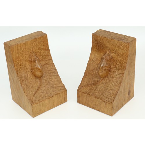 1429 - Robert Mouseman Thompson of Kilburn - pair of adzed oak bookends, carved with signature mice, W8.5cm... 