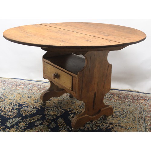 1396 - Early C20th waxed pine chair table, circular planked tilt top with shaped arms, solid seat and drawe... 