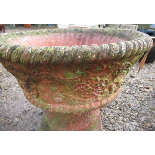 2309 - Reconstituted stone terracotta effect urns with fruit and floral design