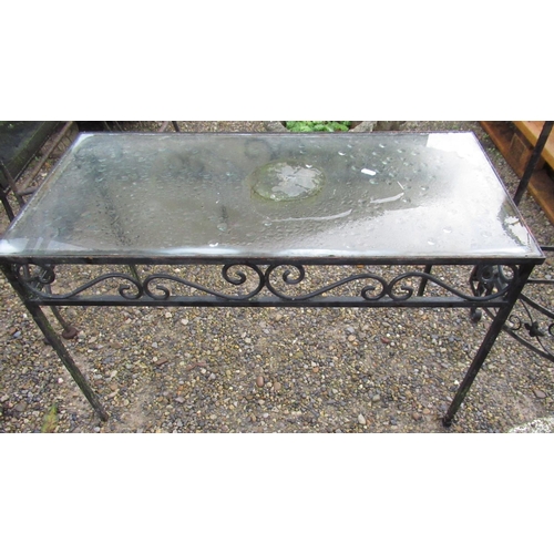 2312 - Conservatory table with glass top and metal legs, a half-moon two-tiered planter with flower and scr... 