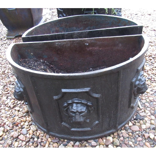 2289 - Pair of half moon cast iron planters with lion motif, 79cm x 26cm x 30cm