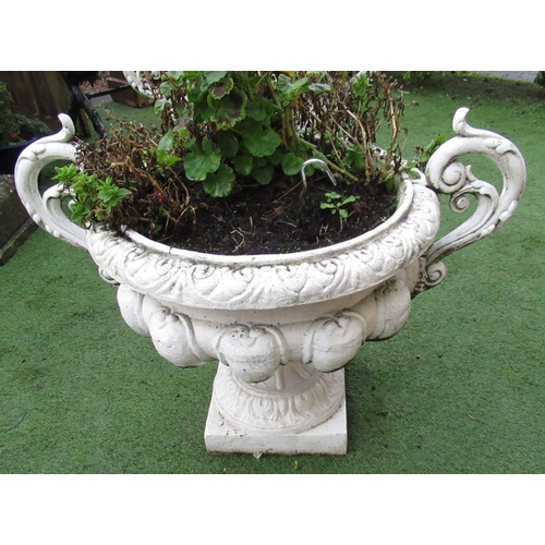 2302 - Large pair of cast iron urns, with ornate floral handles and scroll rims, on square bases, (2)