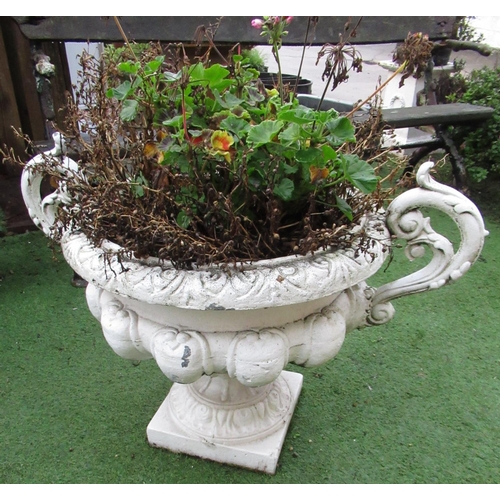 2302 - Large pair of cast iron urns, with ornate floral handles and scroll rims, on square bases, (2)