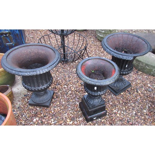 2292 - Pair of cast garden urns (one A/F) 50cm x 44cm, single cast garden urn 50cm x 29cm (3)