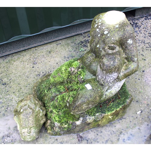 2234 - The Grange Goathland - Statue of a reclining cherub seated on a stone plinth holding a large fish un... 