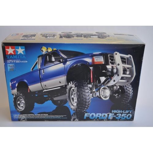 301 - Unbuilt boxed Tamiya 1/10th scale Ford F-350 High Lift radio control 4x4 Pick-up truck, item no 5837... 