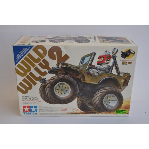 303 - Tamiya 1/10 scale radio control Wild Willy 2, chassis built up, bodywork not started.
Runs but steer... 