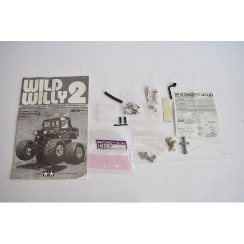 303 - Tamiya 1/10 scale radio control Wild Willy 2, chassis built up, bodywork not started.
Runs but steer... 