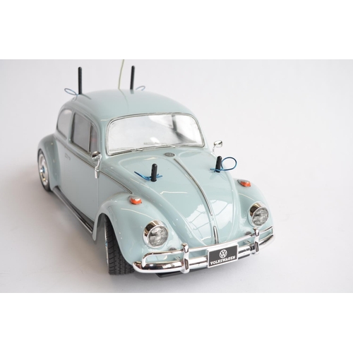 304 - Competently built up Tamiya 1/10th scale radio control Volkswagen Beetle model. Has a TX26.995MHz re... 