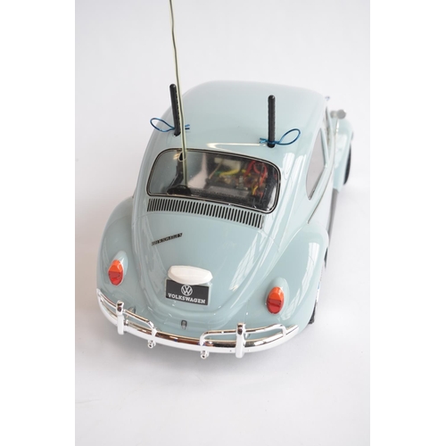 304 - Competently built up Tamiya 1/10th scale radio control Volkswagen Beetle model. Has a TX26.995MHz re... 