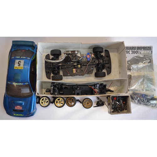 309 - 2 Tamiya 1/10 glow engine powered remote control cars, both A/F. Item No 44034-27800 Subaru Impreza ... 