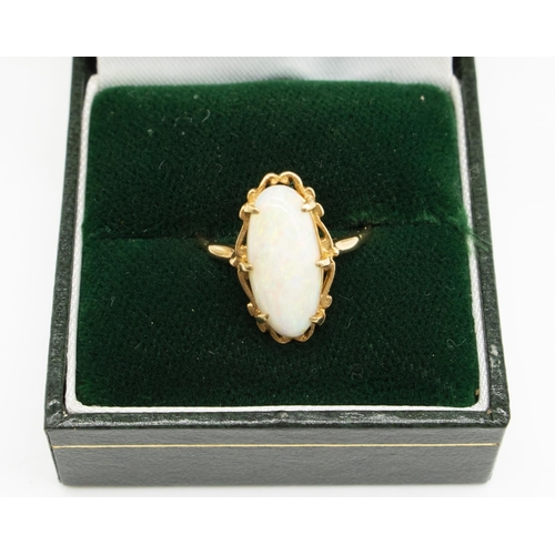 33 - 9ct yellow gold ring set with oval opal in scroll setting, stamped 375, size M1/2, 2.5g