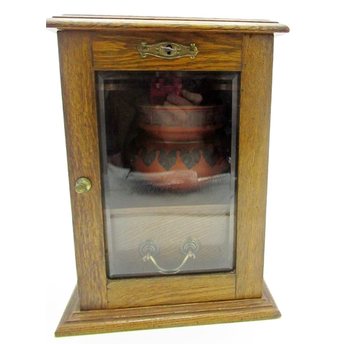 312 - Early c20th oak pipe smoker's cabinet with integrated pipe holder and single drawer, ashtray, and fo... 