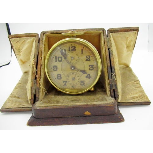 313 - Zenith Watch Co brass cased alarm clock with travel case, pair of c19th brass push up candlesticks, ... 