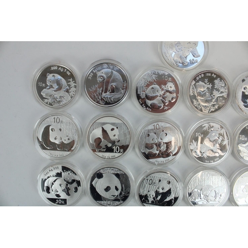 653 - Collection of twenty five Chinese Panda 10 Yuan 1 oz Ag .999 silver coins, all encapsulated, date ra... 