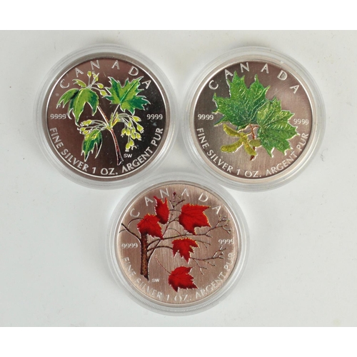 658 - Three Canada 1oz fine silver $5 CAN coins with enamel maple leaf decoration reverse