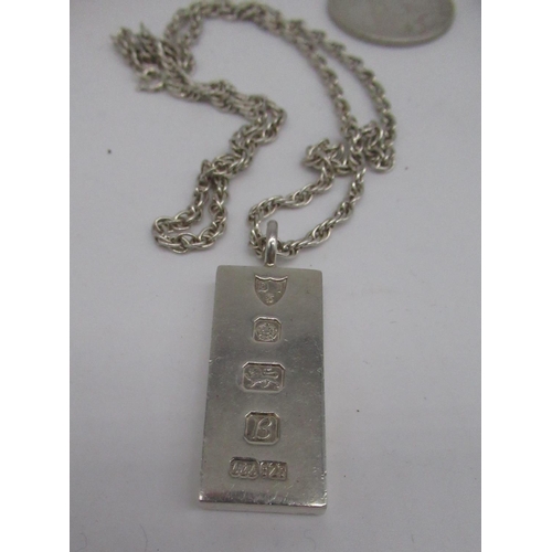 51 - Hallmarked Sterling silver ingot pendant on chain stamped Sterling, another hallmarked silver pendan... 