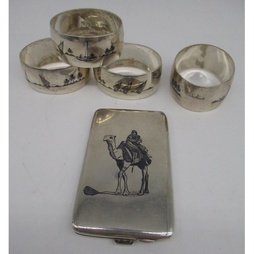 58 - Iraqi white metal card case with niello decoration of a man on a camel, with Arabic mark, and a simi... 