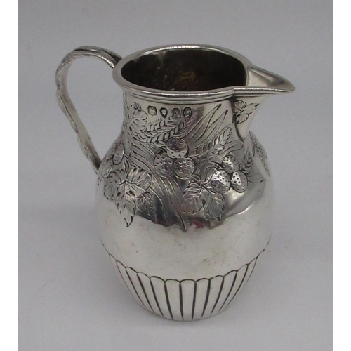 79 - Victorian hallmarked Sterling silver milk jug with repousse fruit detail, rope twist handle and lobe... 