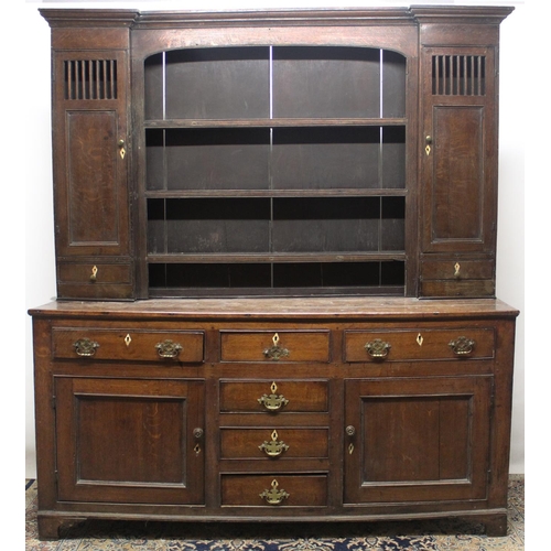 729 - Geo.111 oak dresser, three shelf back with moulded cornice and two doors, base with six drawers and ... 