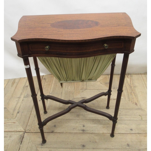 707 - c20th mahogany sewing table with inlaid serpentine top, single frieze drawer and pull-out bag, on tu... 