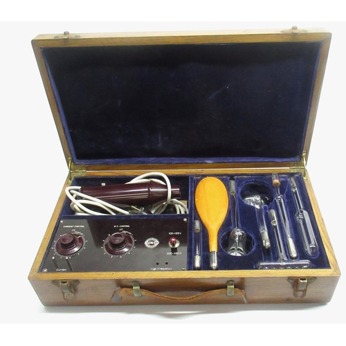 172 - An oak cased Sunco Ultra Violet massager, with a selection of attachments