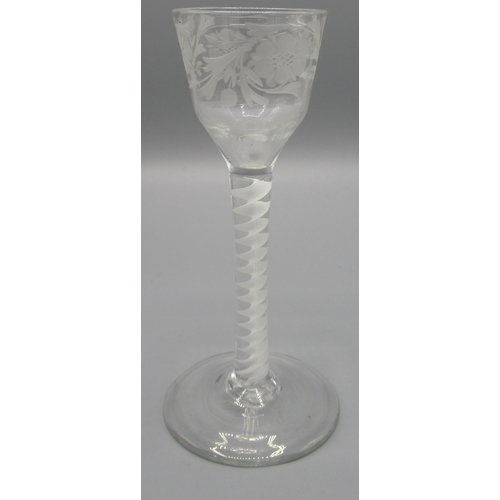 173 - An English wine glass, ogee shaped bowl wheel engraved with flower and foliage, cotton twist stem, c... 