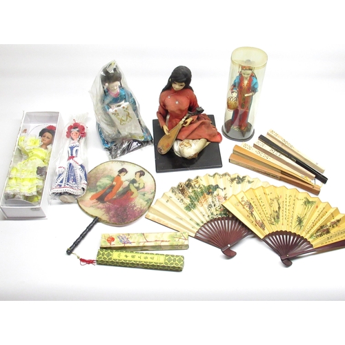 183 - 3 Oriental dolls, 3 Spanish style dolls and a small collection of Oriental fans