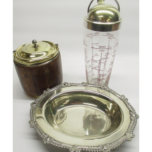 229 - Art Deco period cocktail shaker with silver plated lid, measuring instructions for five cocktails in... 