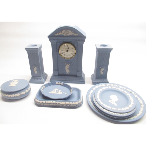 320 - Wedgwood blue Jasperware including Millennium clock and candlesticks, trinket dishes etc.