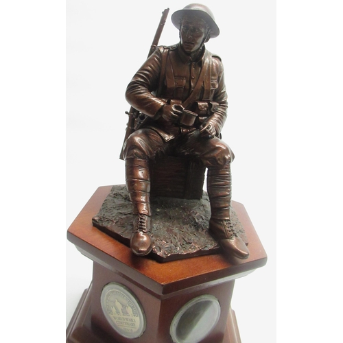 322 - Danbury Mint WWI commemorative figure 'The Brave British Tommy' on base inset with WWI era coins, an... 