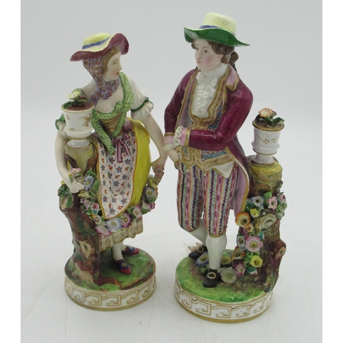 142 - Pair of C19th Continental porcelain models of lady and gentleman gardeners, both in C18th dress with... 