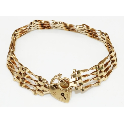 17 - 9ct yellow gold four bar gate bracelet with heart padlock clasp and safety chain, stamped 375, 13.6g