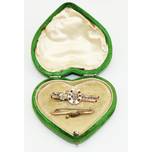 29 - Victorian 9ct yellow gold horseshoe brooch set with red and clear stones, and another 9ct yellow gol... 