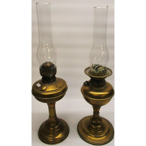 263 - C20th brass bodied oil lamp with reeded column on circular stepped foot, overall H58cm, similar oil ... 