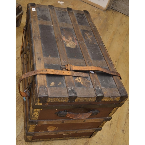 689 - Campaign chest with brass and wood strapping, leather fasteners and leather handles with brass escut... 