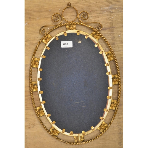 690 - Gilt framed oval mirror with bevelled edge and floral design, 47cm x 30cm