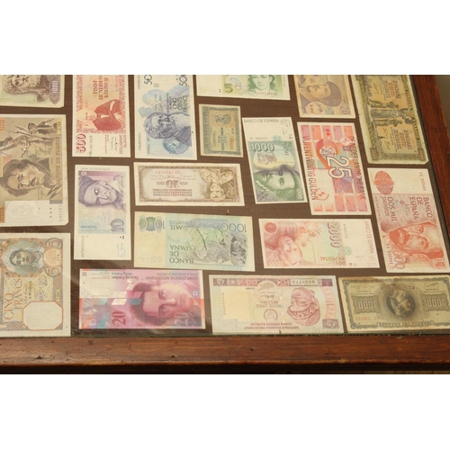 736 - Square topped coffee table inset with collection of world bank notes with glazed top, H48cm