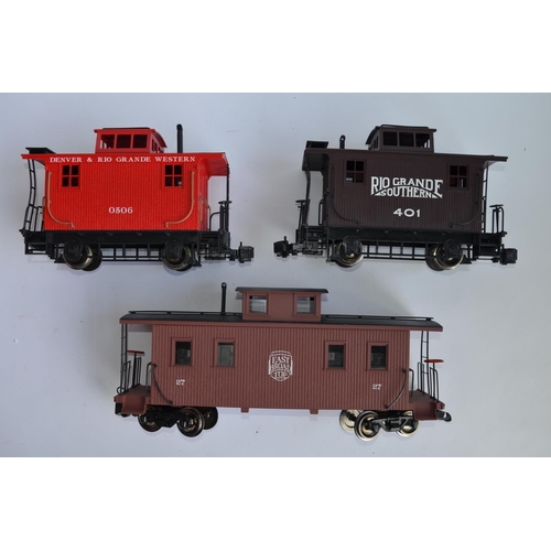 7 - 3 G-gauge Bachman railway Caboose models, 1 twin bogie:
Item No 93827 8-wheel centre cupola wood cab... 