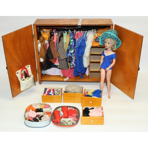 291 - Vintage late 1960s Sindy doll with a large collection of outfits and accessories in a scratch-built ... 