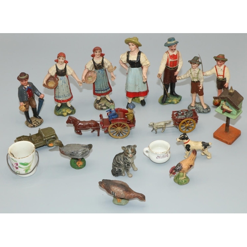 296 - Early c20th dolls house accessories including crockery and a birdhouse, papier-mâché Alpine figures,... 