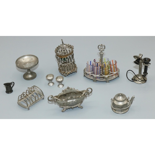 299 - Early c20th soft metal dolls house accessories of German manufacture including drinking glasses set,... 