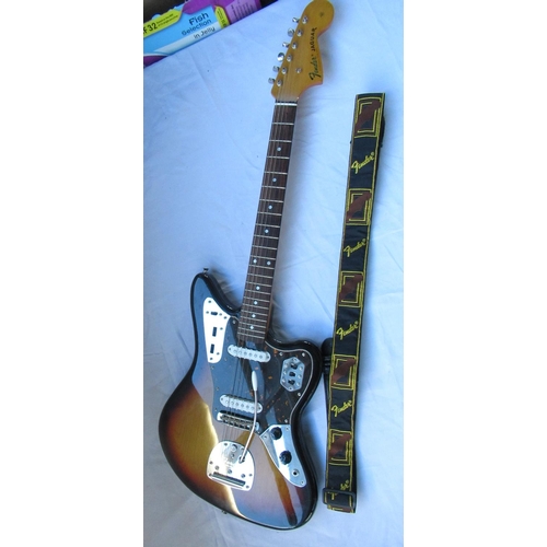 85 - Fender Jaguar 6 string electric guitar, in sunburst finish, made in Japan, serial no. T008586, with ... 