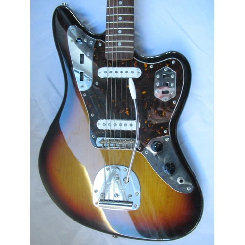 85 - Fender Jaguar 6 string electric guitar, in sunburst finish, made in Japan, serial no. T008586, with ... 