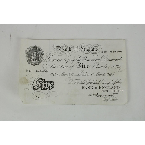 703 - Bank of England white £5 note, 6th of March 1945 Peppiatt together with a Bank of England £5 note.  ... 