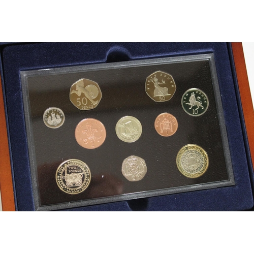 717 - Royal Mint UK 2000 executive proof set, 2003 executive proof set and the 2004 proof coin collection,... 